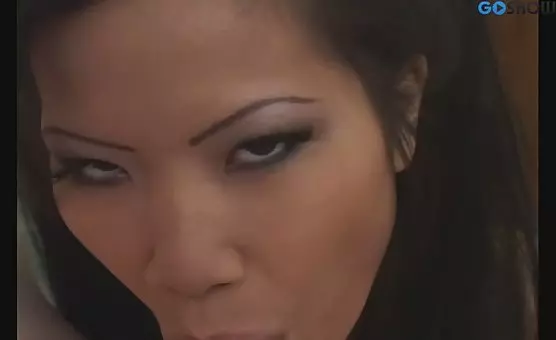 Asian seductress teases in miniskirt and socks, enticing her lover