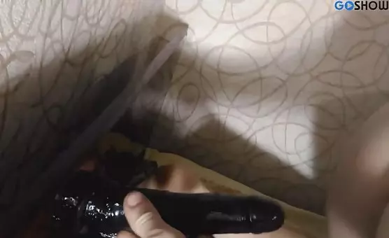 Hot MILF satisfies her desires with an alluring black dildo